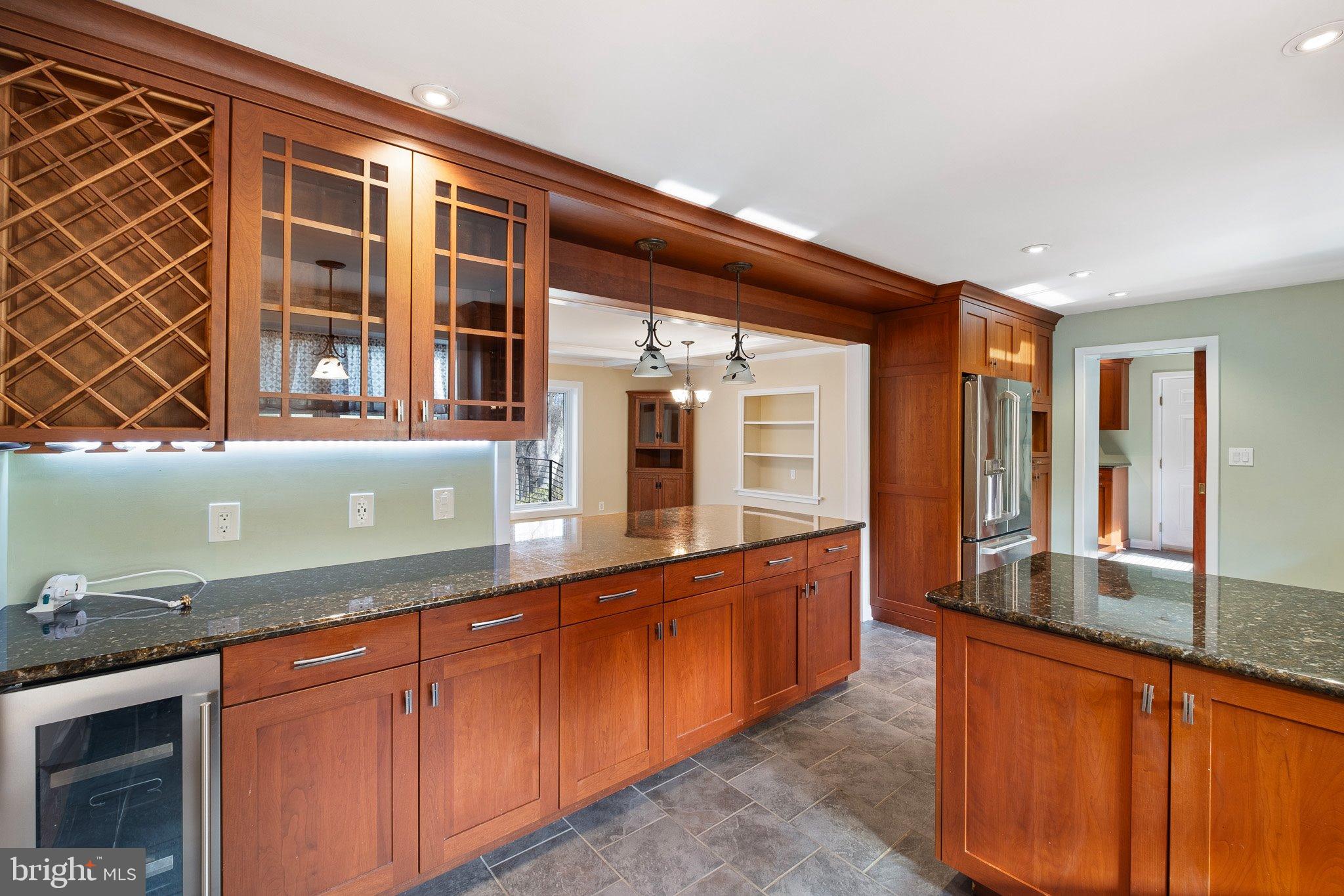 370 Marple Road Broomall, PA 19008 - Photo 20 of 46 a kitchen with granite countertop sink and cabinets
