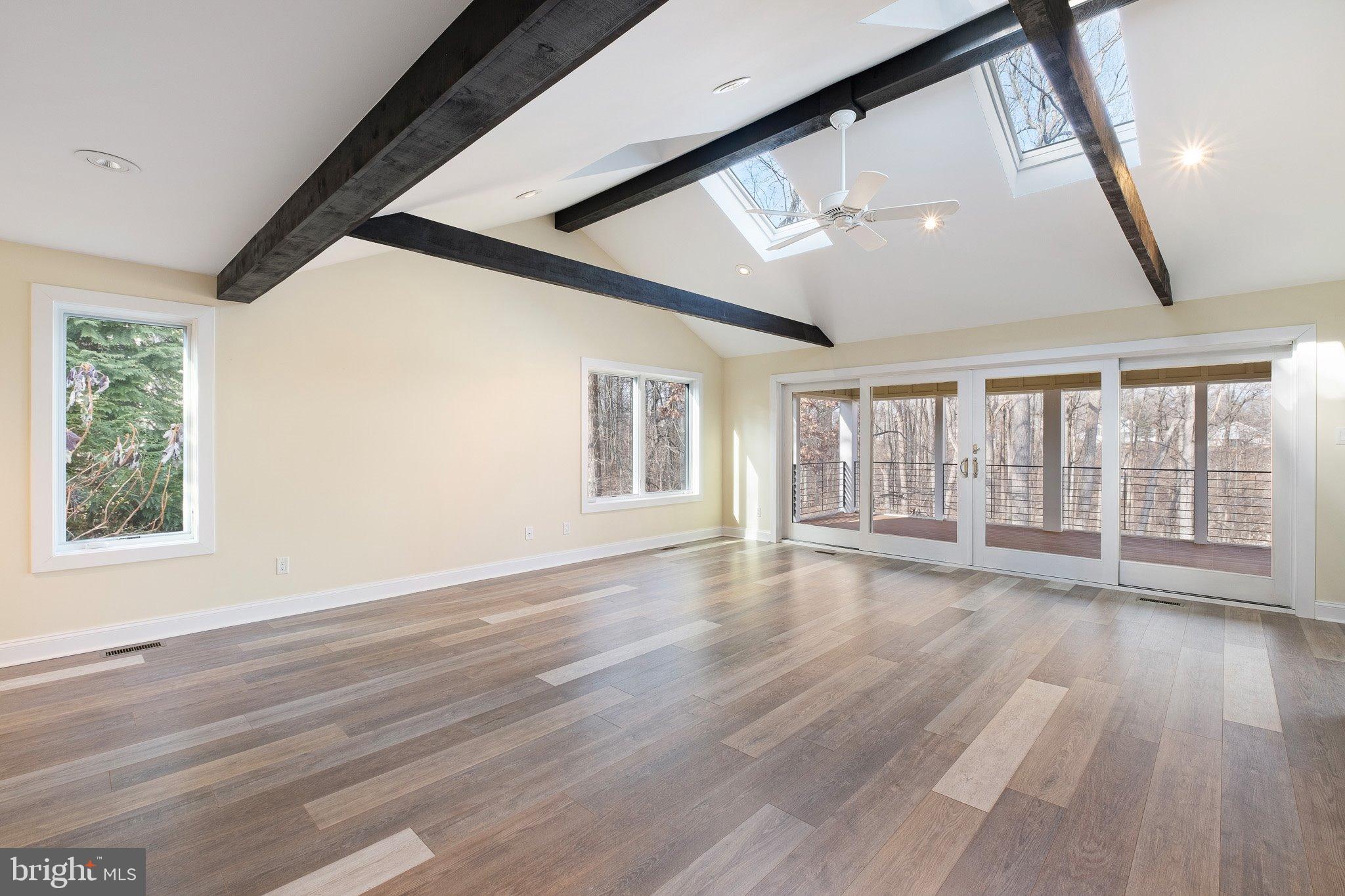 370 Marple Road Broomall, PA 19008 - Photo 28 of 46 a view of an empty room with wooden floor and a window