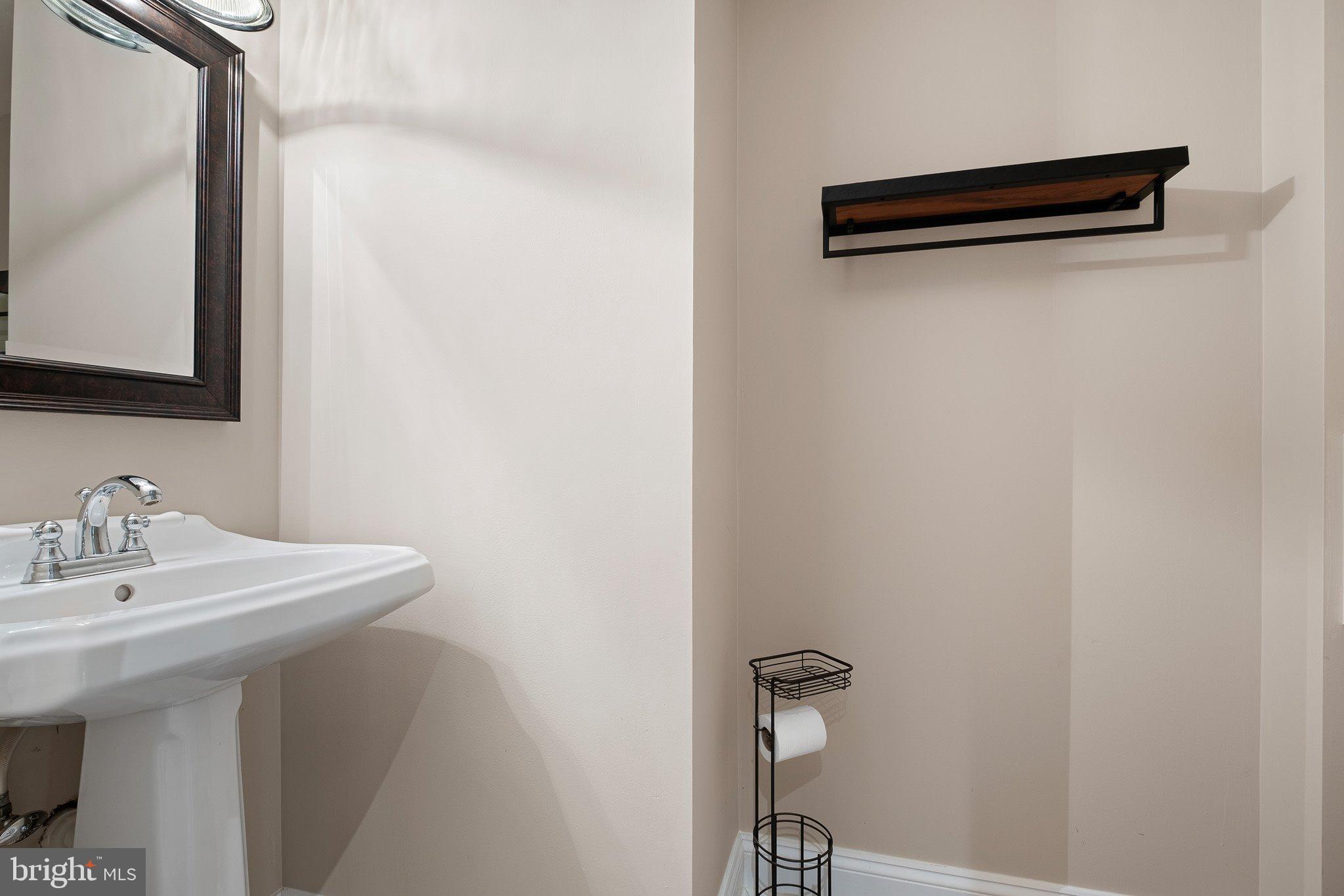 370 Marple Road Broomall, PA 19008 - Photo 30 of 46 a bathroom with a sink and a mirror