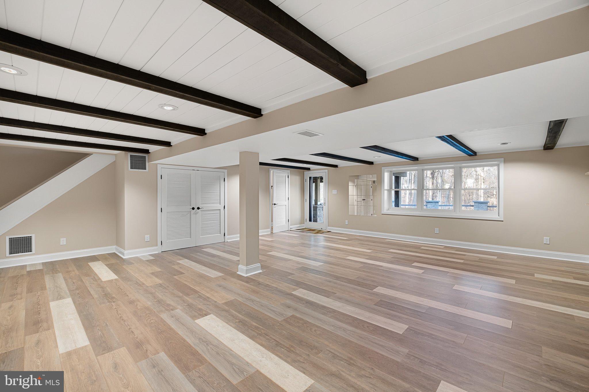 370 Marple Road Broomall, PA 19008 - Photo 32 of 46 a view of empty room with wooden floor and fan