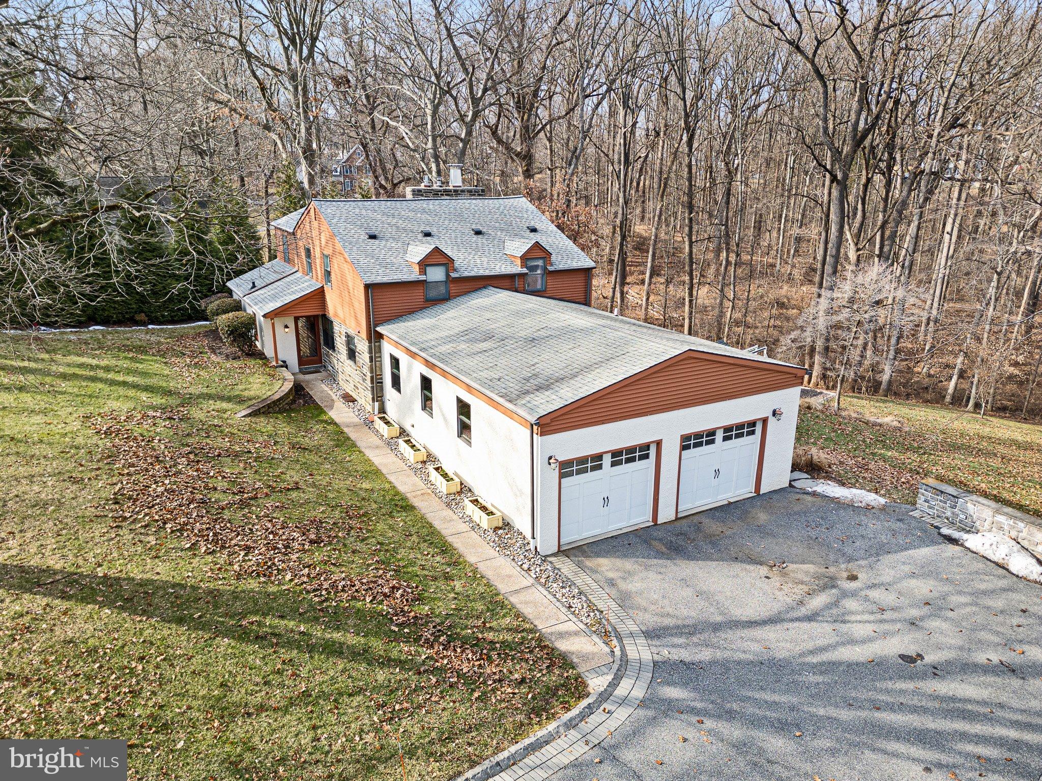 370 Marple Road Broomall, PA 19008 - Photo 4 of 46 a big white house with a yard and wooden fence