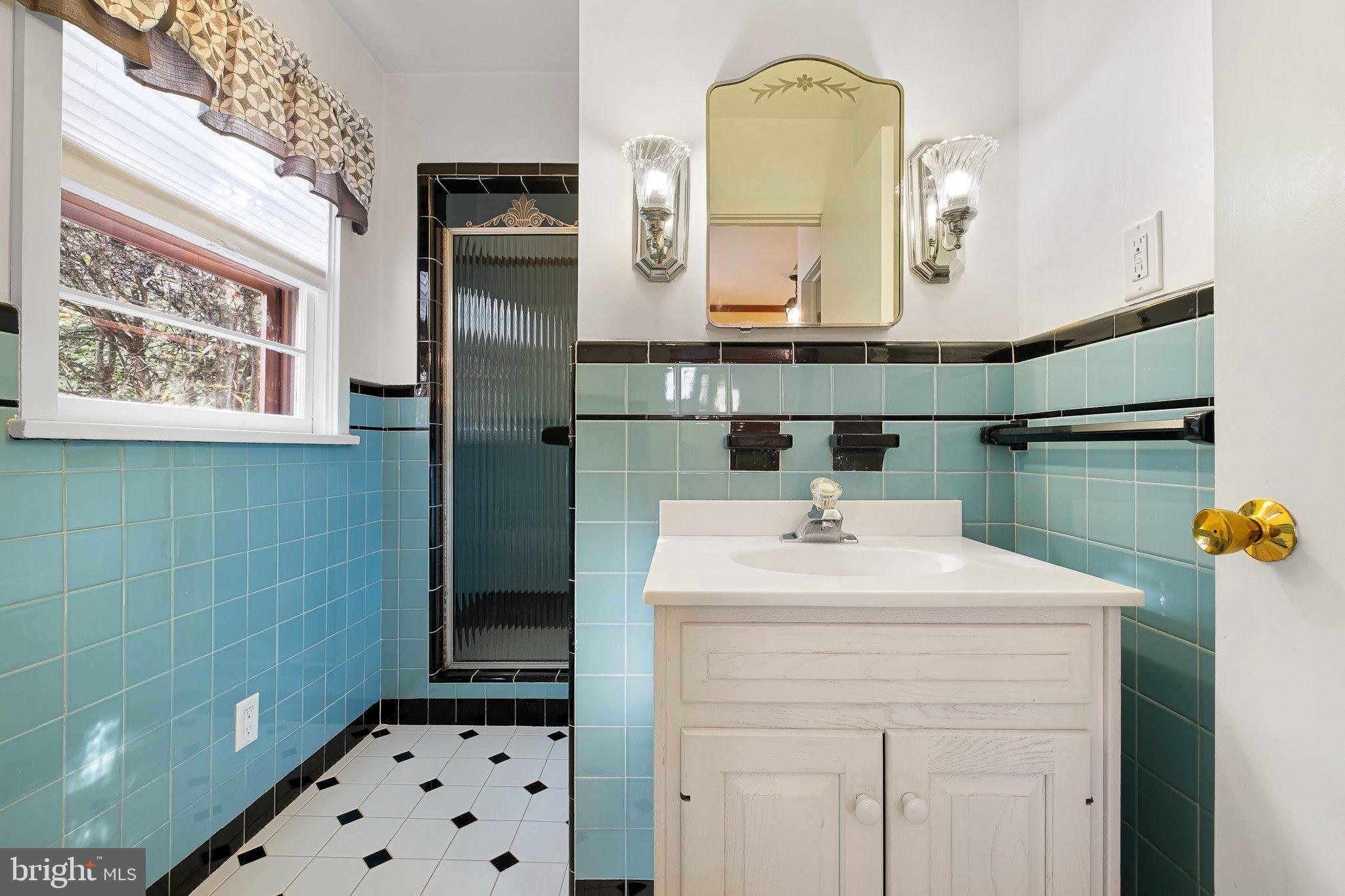 370 Marple Road Broomall, PA 19008 - Photo 43 of 46 a bathroom with a sink a toilet and mirror