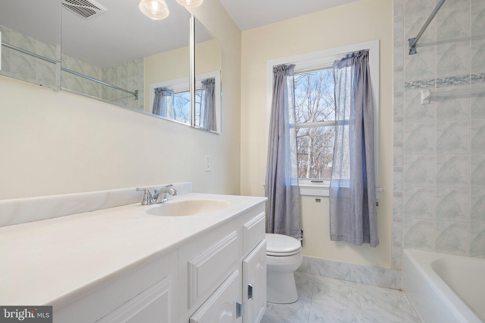 370 Marple Road Broomall, PA 19008 - Photo 44 of 46 a bathroom with a sink a toilet and shower