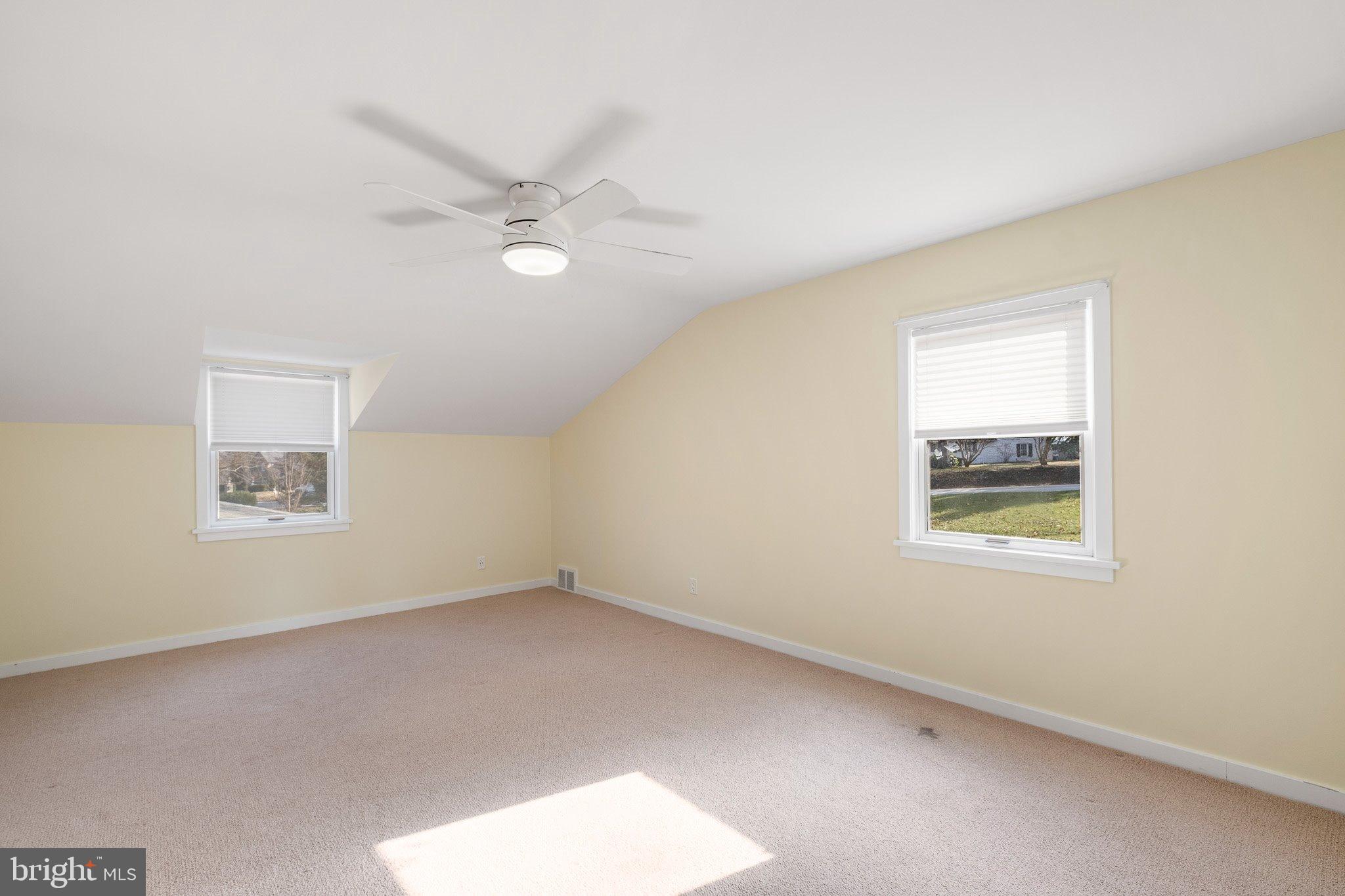 370 Marple Road Broomall, PA 19008 - Photo 46 of 46 an empty room with a window and a fan