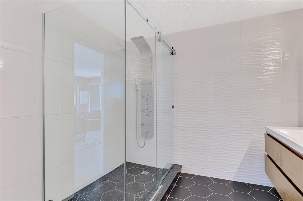 5303 Hidden Harbor Road Sarasota, FL 34242 - Photo 42 of 72 a bathroom with a shower and a sink