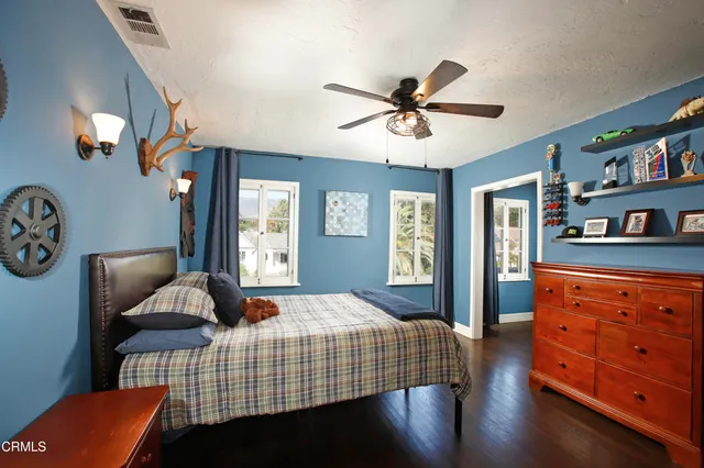 a bedroom with furniture and window