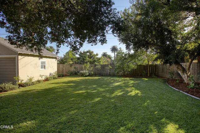 a backyard of a house with lots of green space