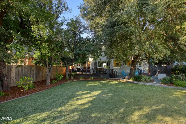 a view of a house with a yard porch and sitting area
