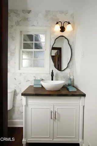 a bathroom with a sink and a mirror
