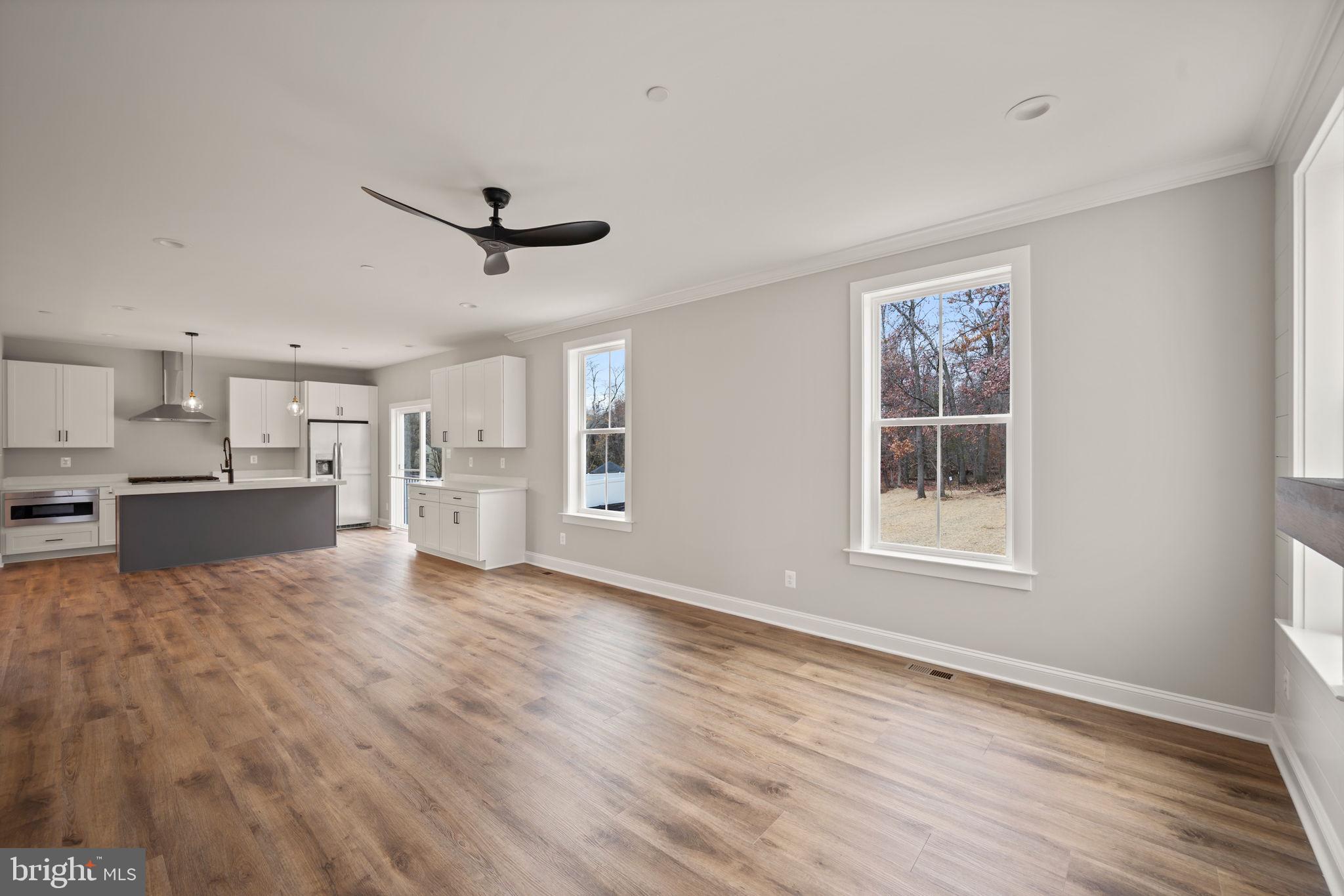 9436 Ridgely Avenue Baltimore, MD 21234 - Photo 16 of 44 a view of a kitchen with wooden floor and a kitchen