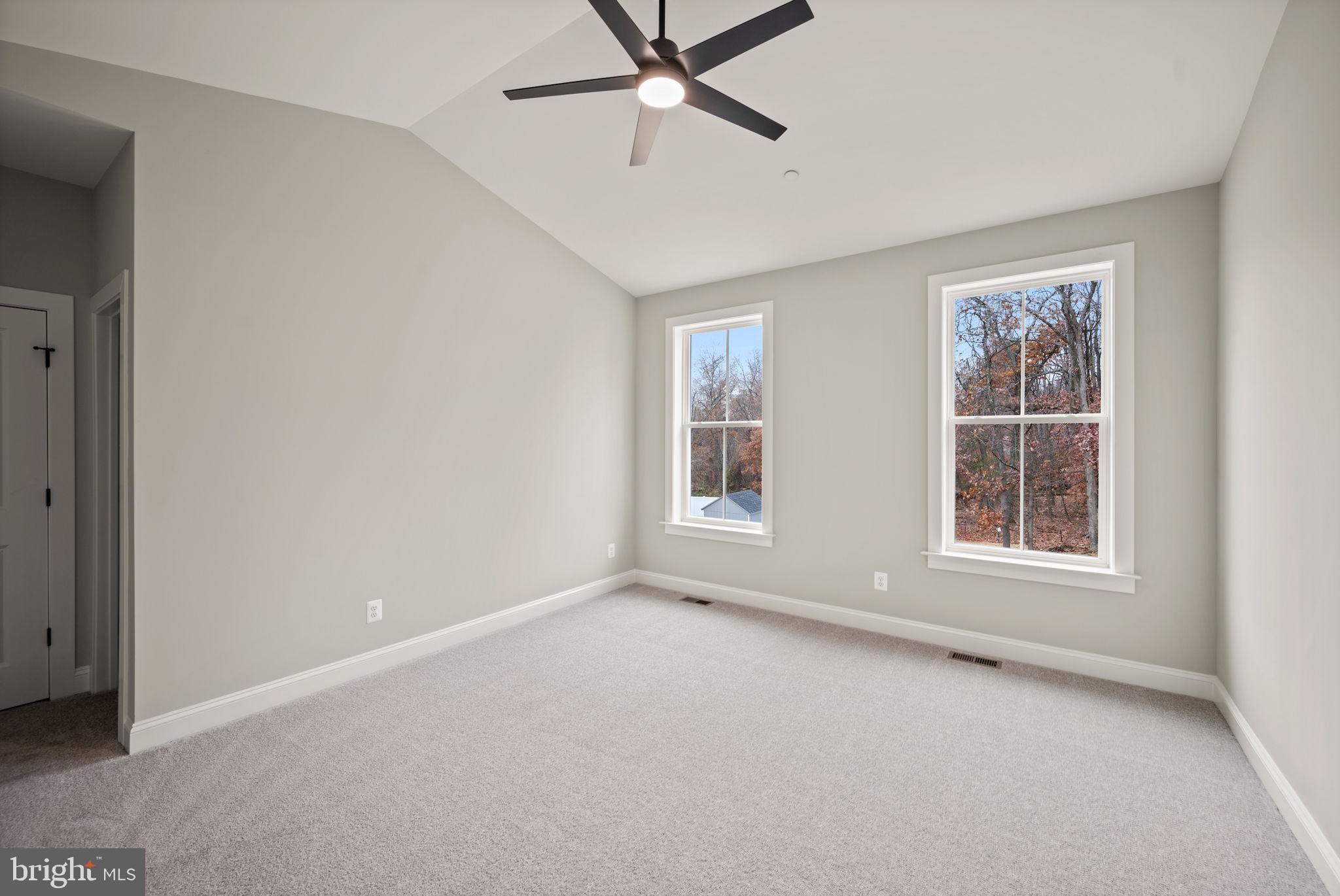 9436 Ridgely Avenue Baltimore, MD 21234 - Photo 19 of 44 a view of an empty room with a window