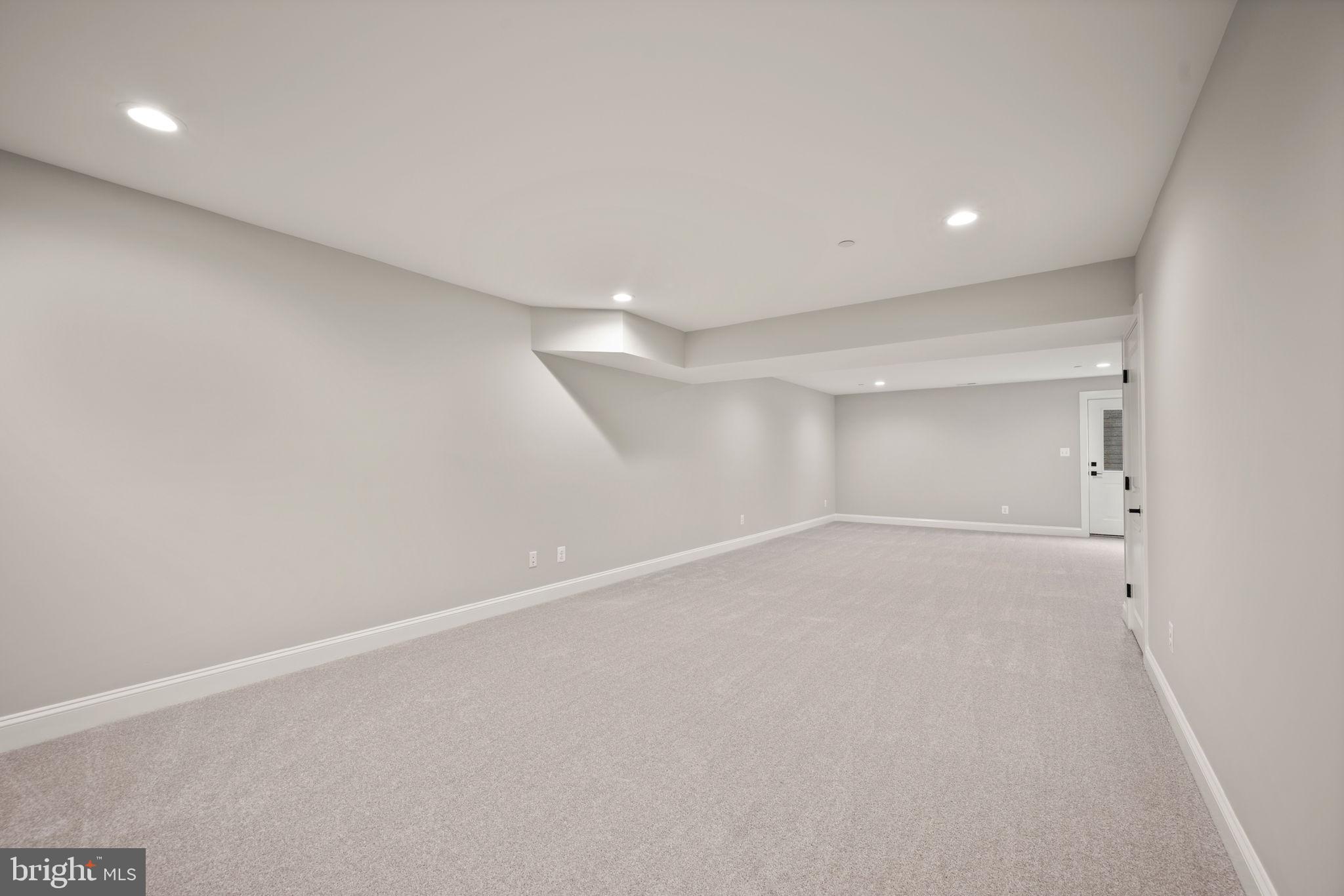 9436 Ridgely Avenue Baltimore, MD 21234 - Photo 35 of 44 an empty room with a empty space and windows