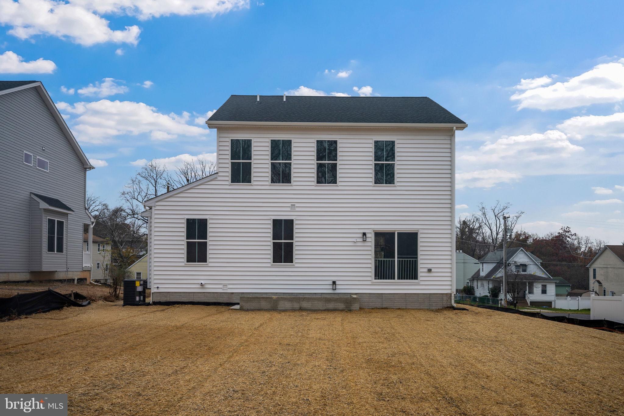 9436 Ridgely Avenue Baltimore, MD 21234 - Photo 39 of 44 a front view of a house with a yard