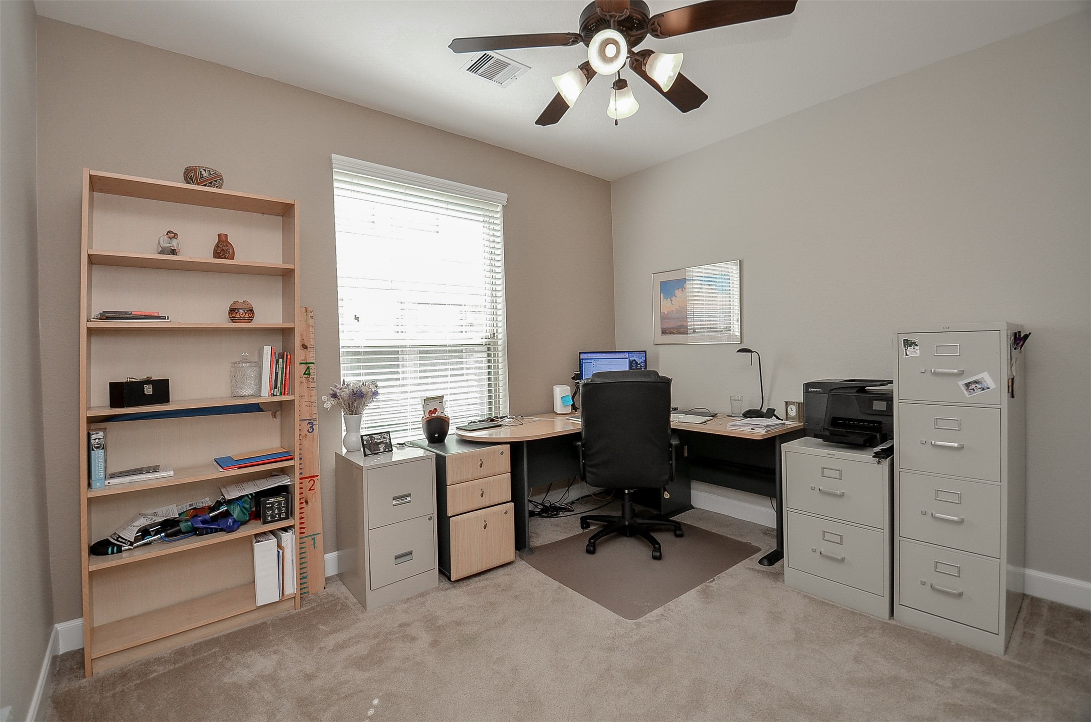 1310 Ellis Grove Lane Rosenberg, TX 77471 - Photo 11 of 38 a view of a workspace with furniture and a window