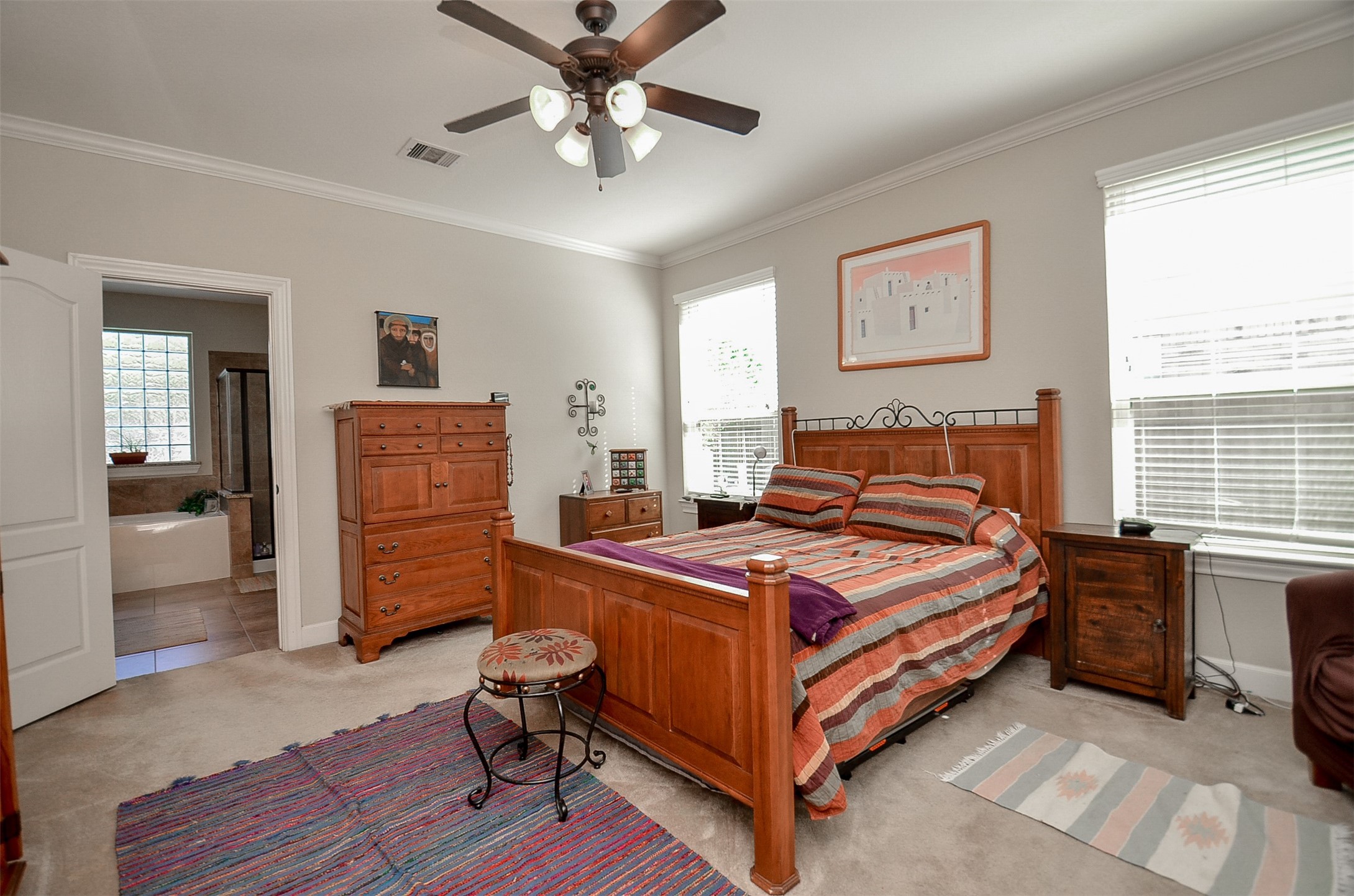 1310 Ellis Grove Lane Rosenberg, TX 77471 - Photo 18 of 38 a bedroom with a bed and a chandelier