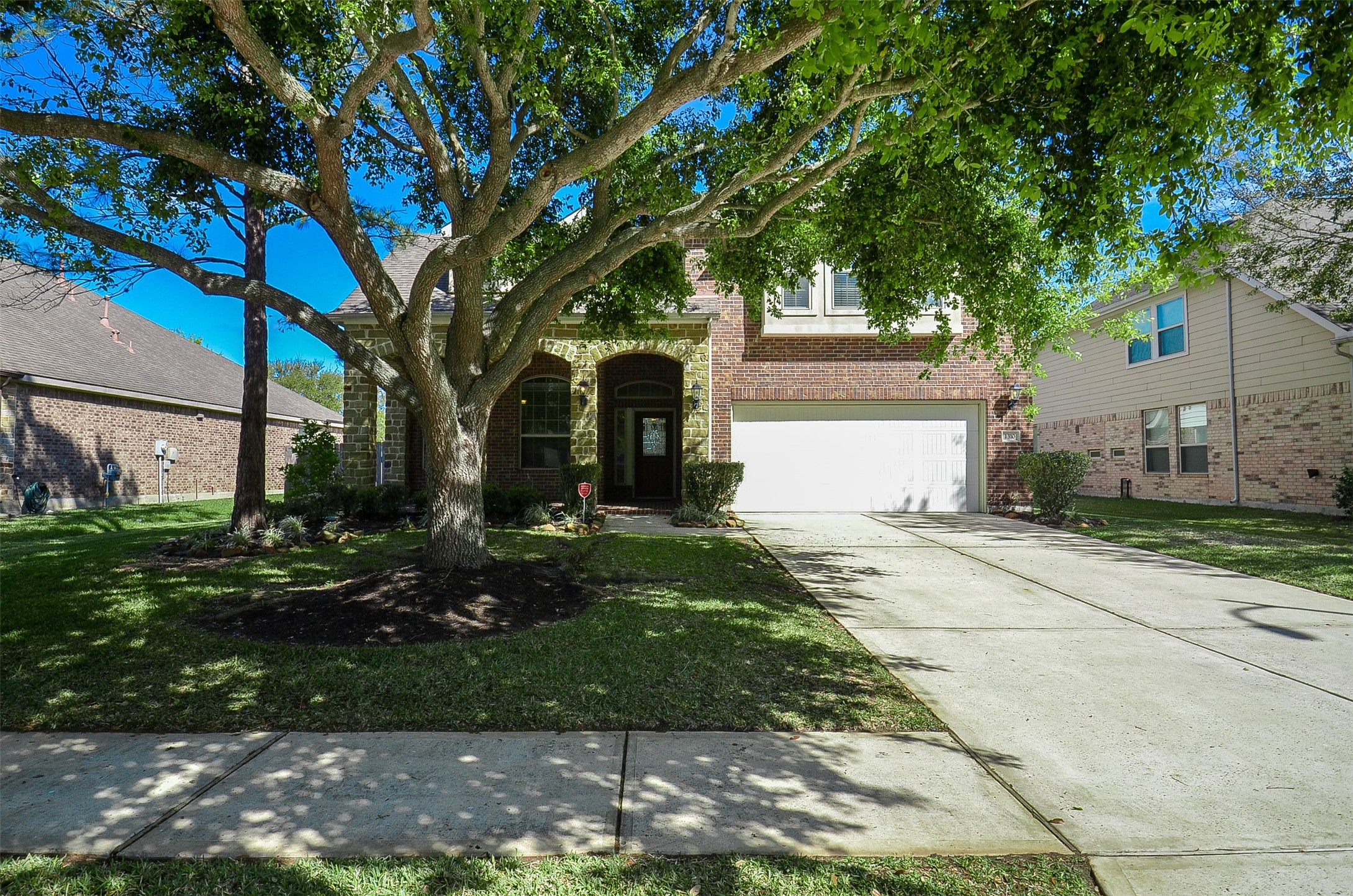 1310 Ellis Grove Lane Rosenberg, TX 77471 - Photo 2 of 38 a front view of a house with garden