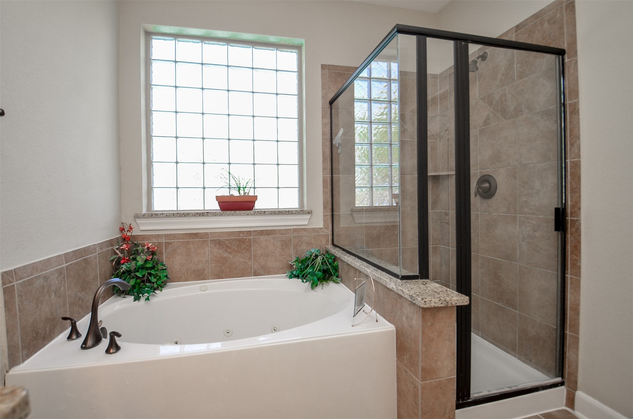 1310 Ellis Grove Lane Rosenberg, TX 77471 - Photo 21 of 38 a white bath tub sitting in a bathroom next to a window