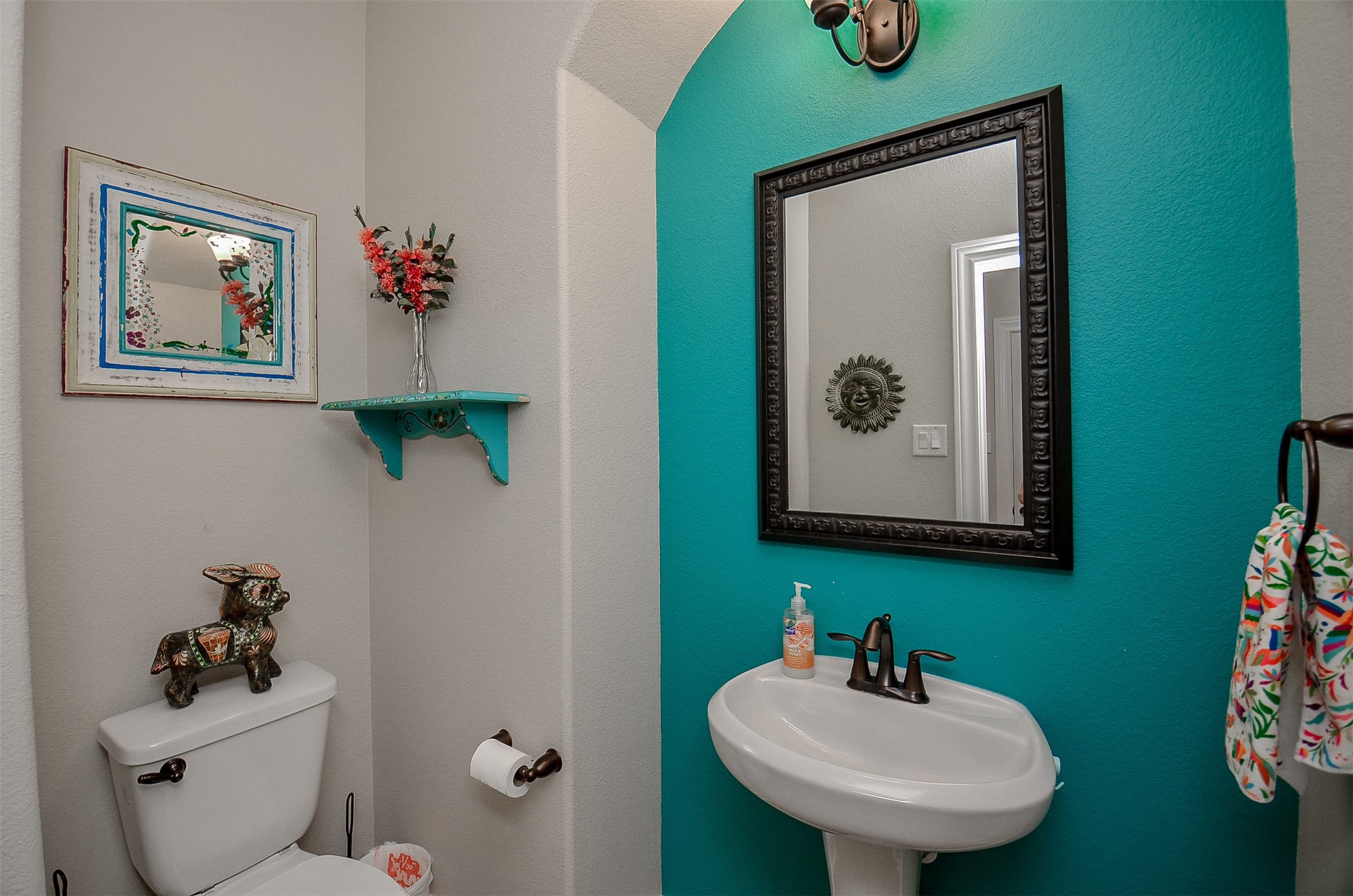 1310 Ellis Grove Lane Rosenberg, TX 77471 - Photo 22 of 38 a bathroom with a toilet sink and mirror