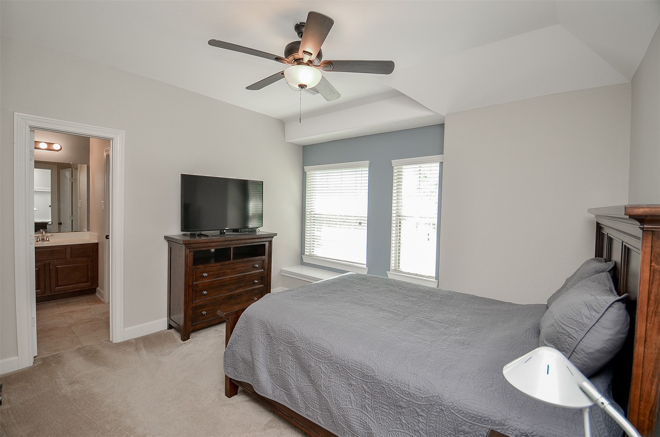 1310 Ellis Grove Lane Rosenberg, TX 77471 - Photo 25 of 38 a bedroom with a bed and a flat screen tv