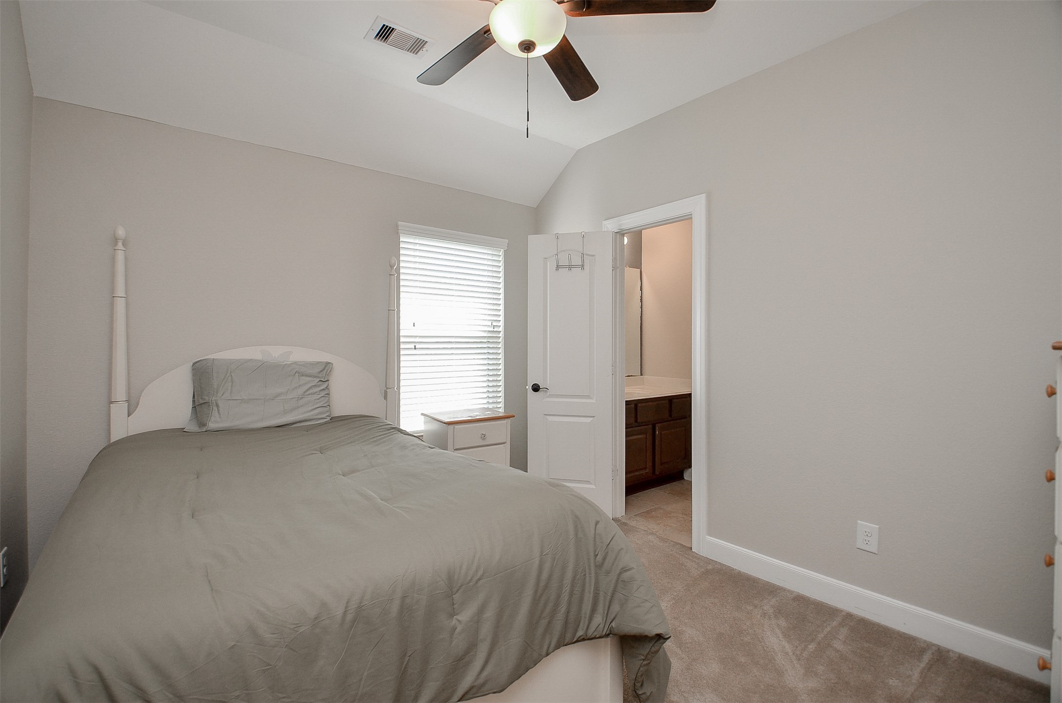 1310 Ellis Grove Lane Rosenberg, TX 77471 - Photo 28 of 38 a bedroom with a bed and a ceiling fan