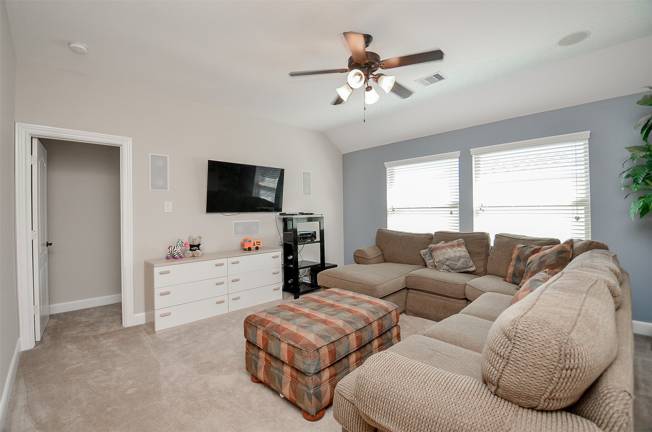 1310 Ellis Grove Lane Rosenberg, TX 77471 - Photo 29 of 38 a living room with furniture and a flat screen tv