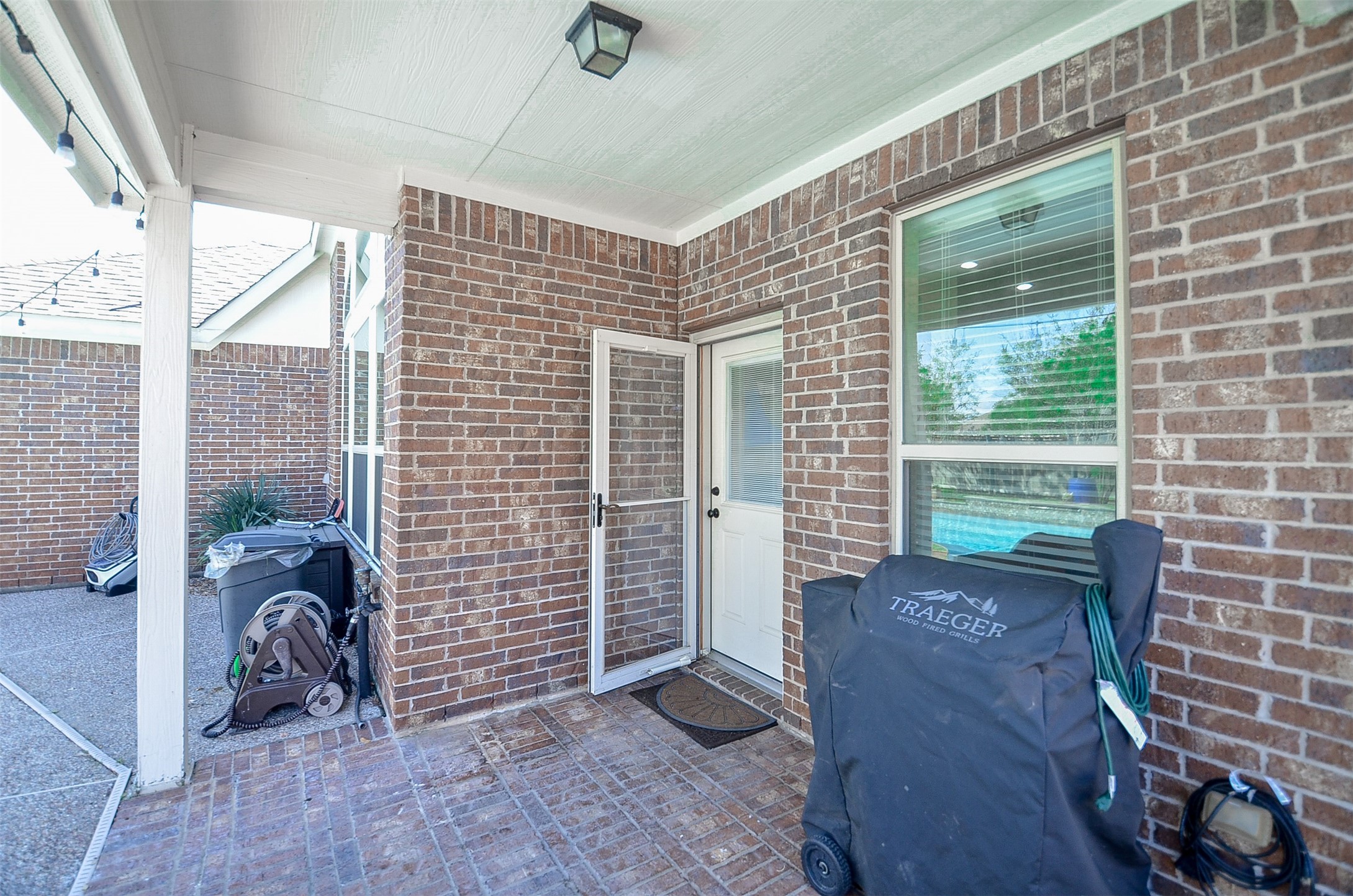 1310 Ellis Grove Lane Rosenberg, TX 77471 - Photo 32 of 38 a view of a brick house with a large window