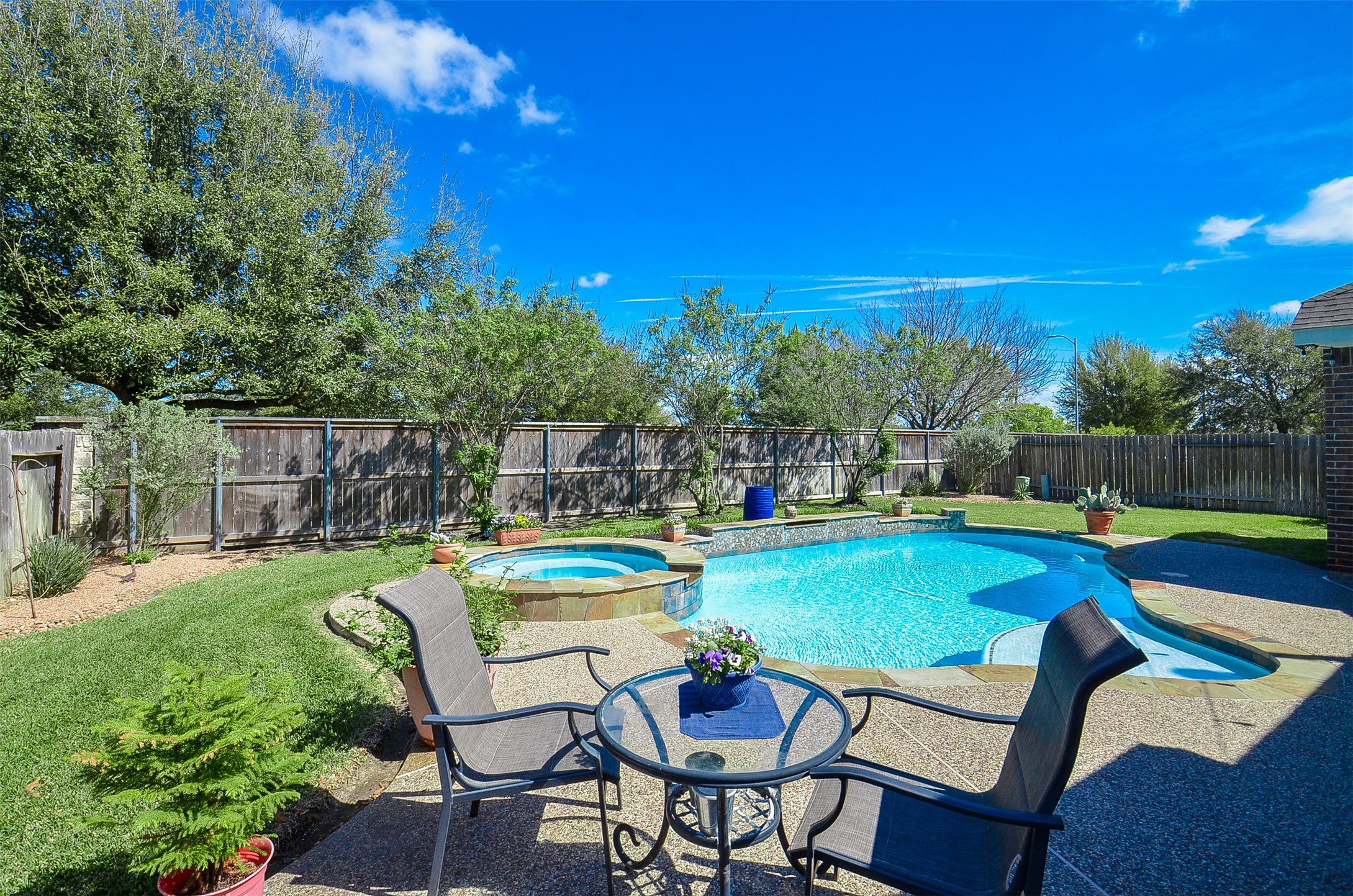 1310 Ellis Grove Lane Rosenberg, TX 77471 - Photo 33 of 38 a table and chairs in patio with swimming pool