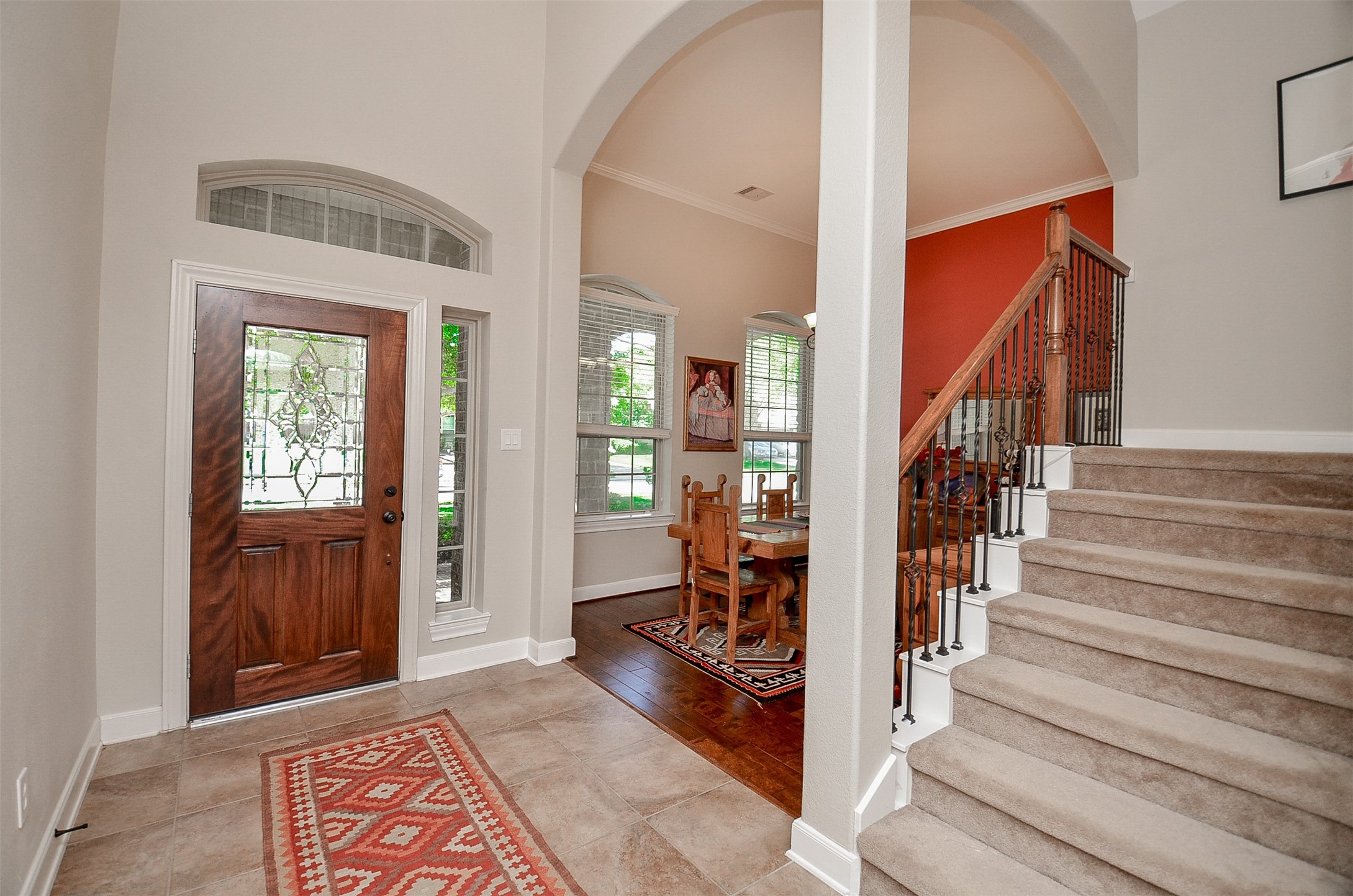 1310 Ellis Grove Lane Rosenberg, TX 77471 - Photo 7 of 38 a view of an entryway with wooden floor and a livingroom