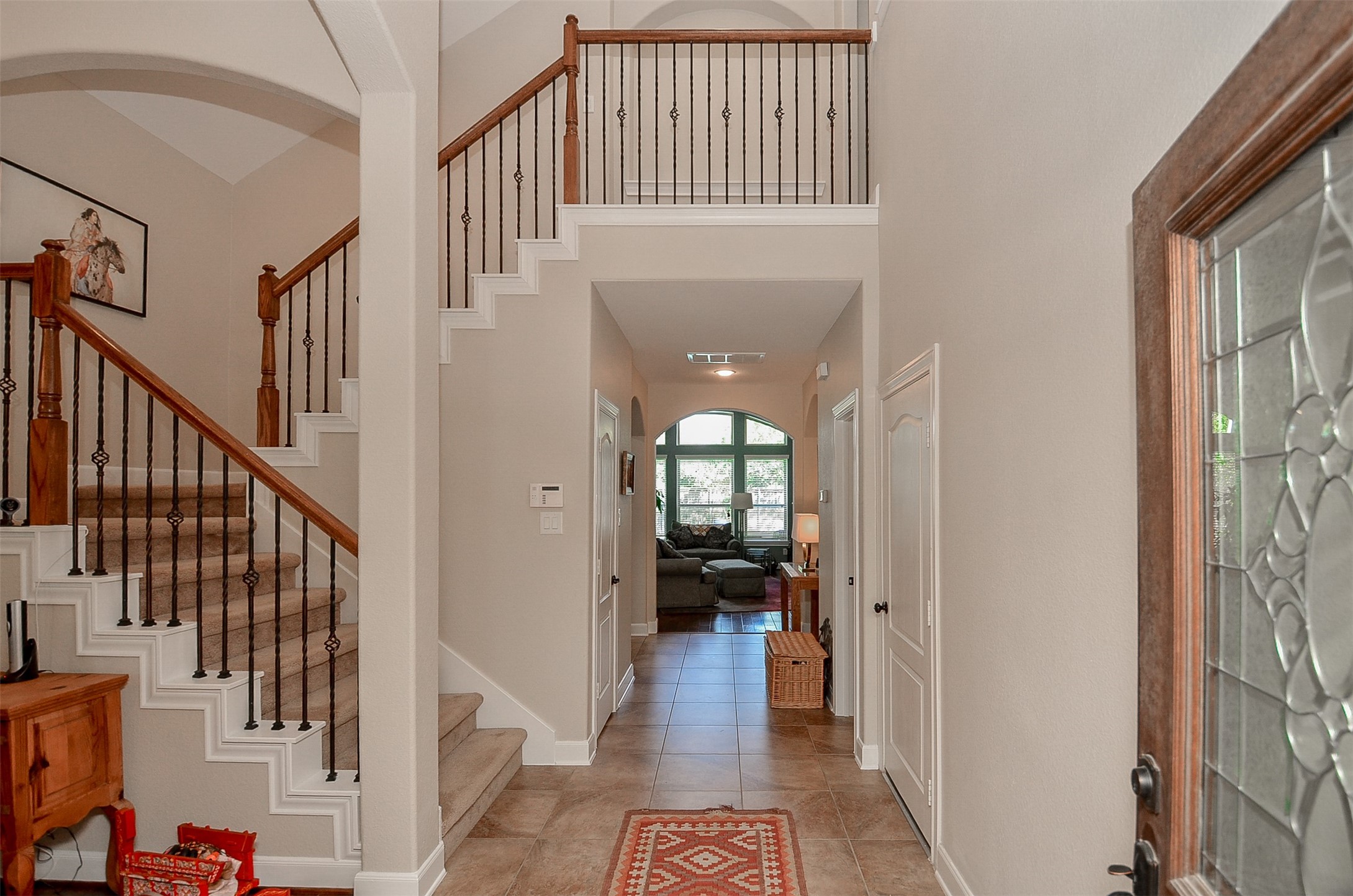 1310 Ellis Grove Lane Rosenberg, TX 77471 - Photo 8 of 38 a view of a hallway with wooden floor and stairs