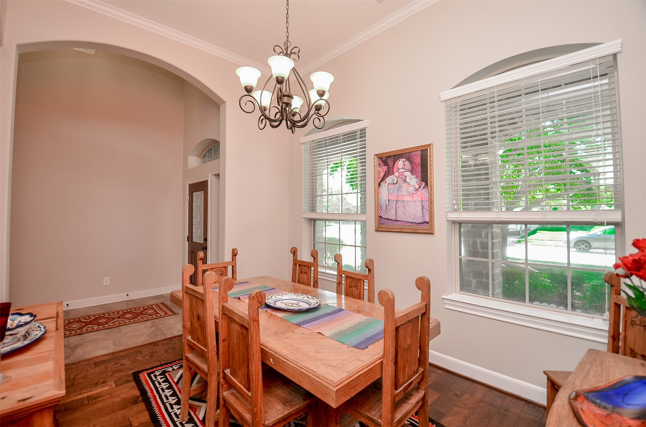 1310 Ellis Grove Lane Rosenberg, TX 77471 - Photo 10 of 38 a view of a dining room with furniture wooden floor and chandelier
