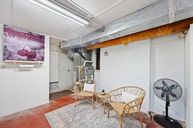 a view of a hallway with paintings on the wall