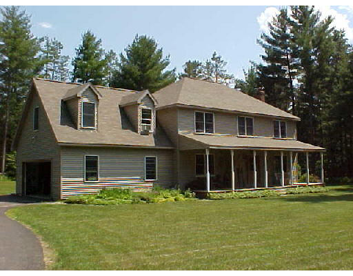 89 Off Ruggles Street Hardwick, MA 01031 - Photo 1 of 1 a front view of a house with a garden