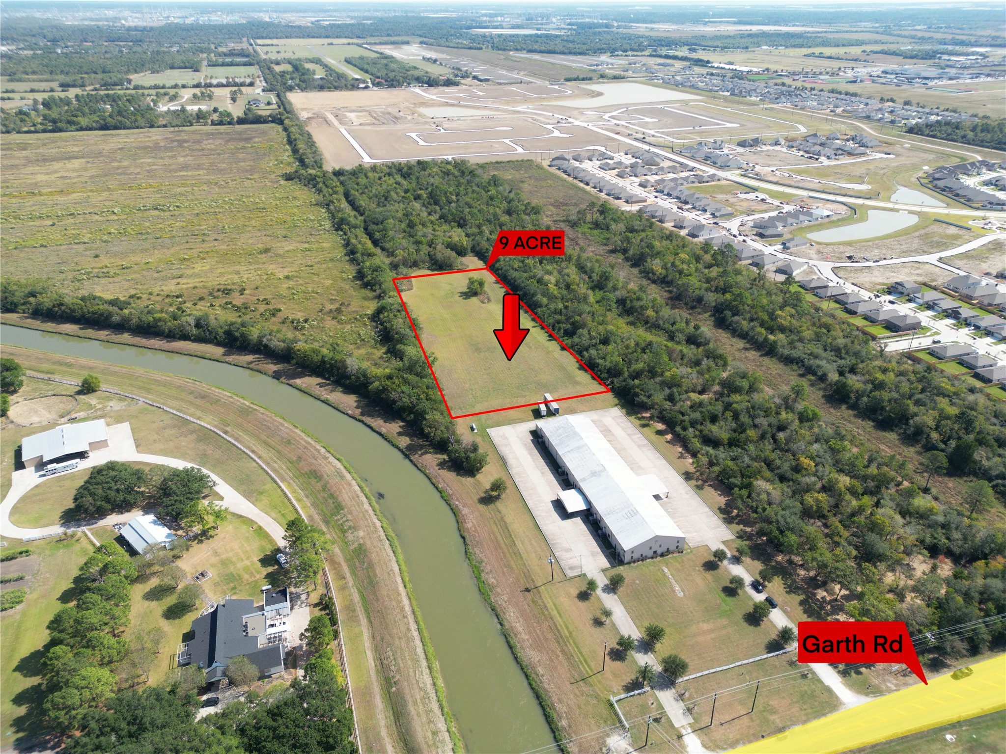 9006 Garth Road Baytown, TX 77521 - Photo 2 of 6 an aerial view of residential houses with outdoor space