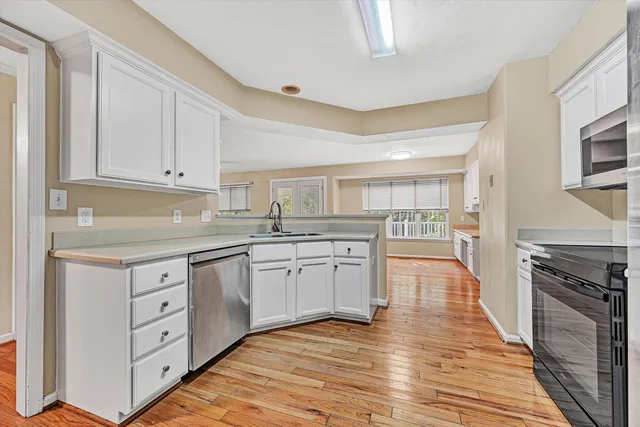 a kitchen with stainless steel appliances a stove and a refrigerator