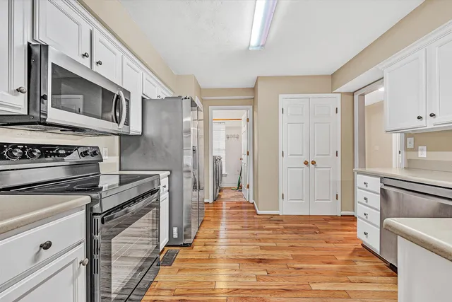 wooden floor in an empty room with a fireplace