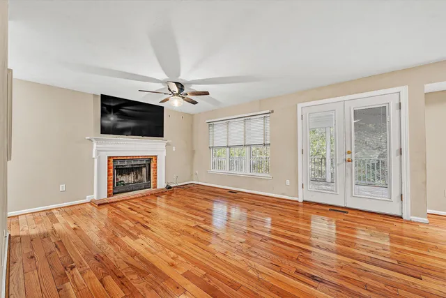 a view of a balcony with wooden floor