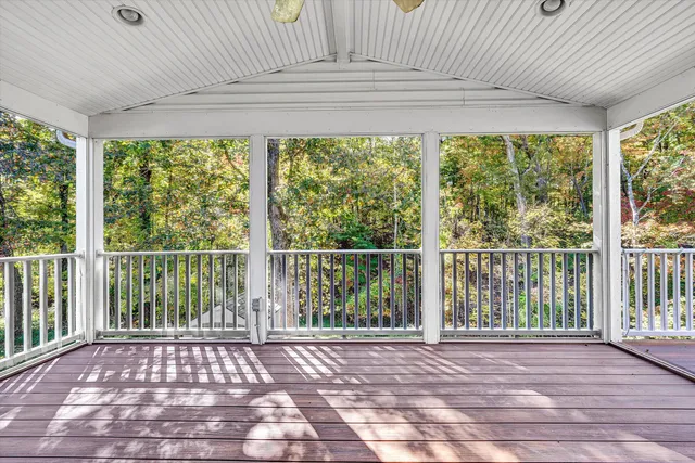 a white toilet sitting next to a shower
