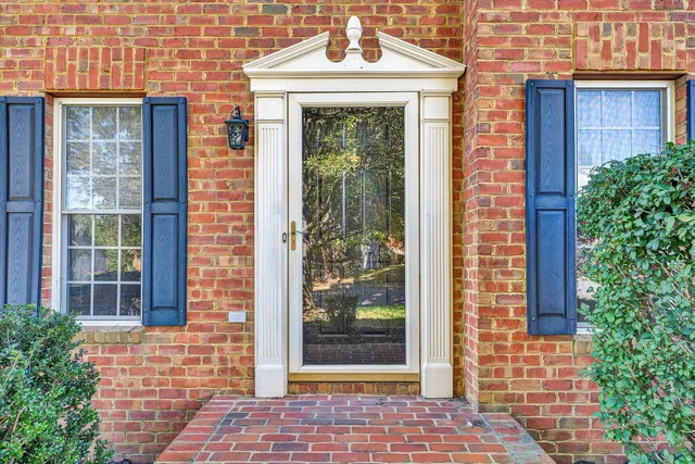 a front view of a house with a glass door