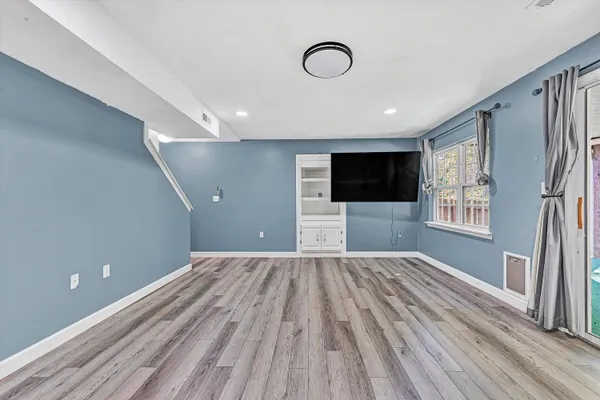 a view of a house with yard and deck