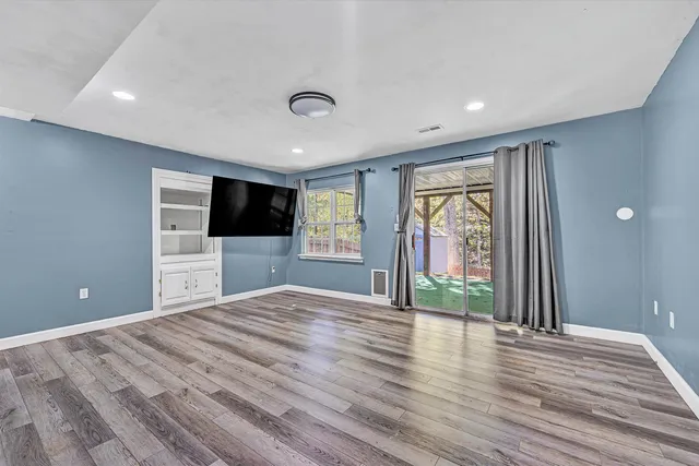 a front view of a house with wooden fence