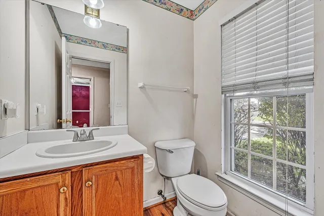a kitchen with granite countertop a refrigerator stove top oven and sink