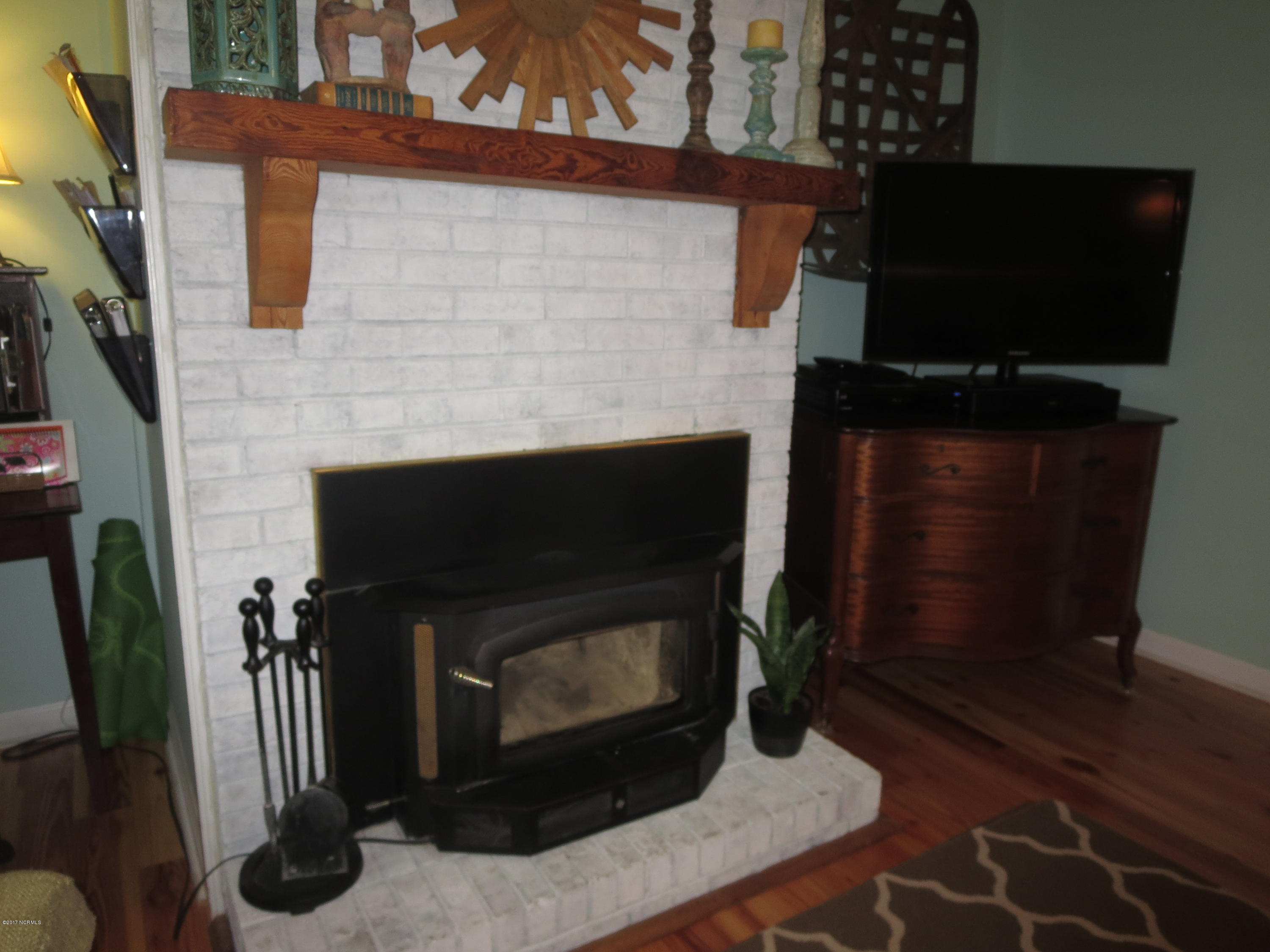 8488 Old 125 Road Scotland Neck, NC 27874 - Photo 34 of 69 den fireplace