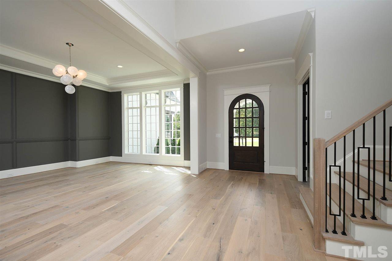 1428 Sky Vista Way Raleigh, NC 27613 - Photo 3 of 21 wooden floor in an empty room with a window
