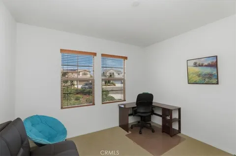 a workspace with furniture and a window