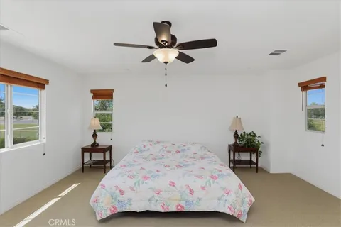 a bedroom with a bed and a table in it