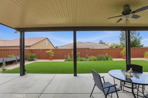 a patio with table and chairs