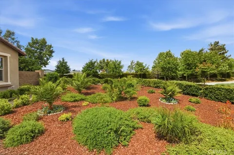a view of a street with a garden