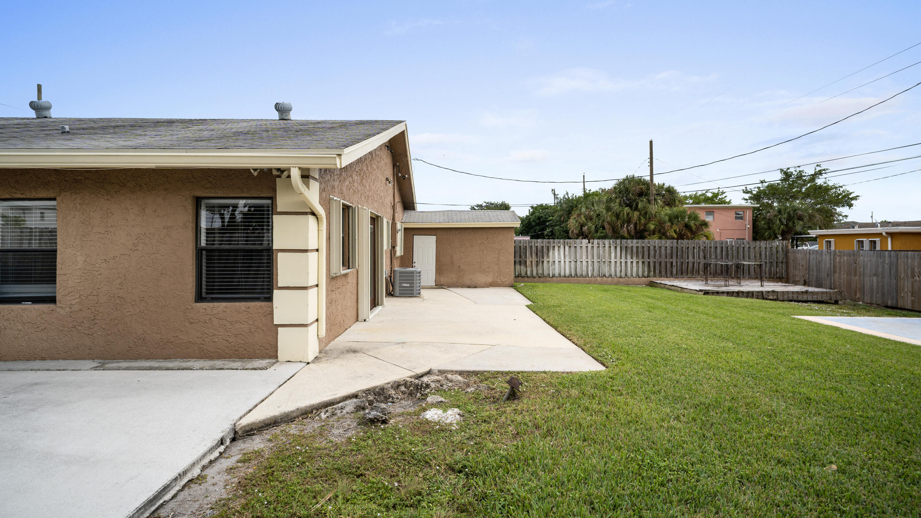 1233 West 32nd Street Riviera Beach, FL 33404 - Photo 4 of 25 a front view of house with yard