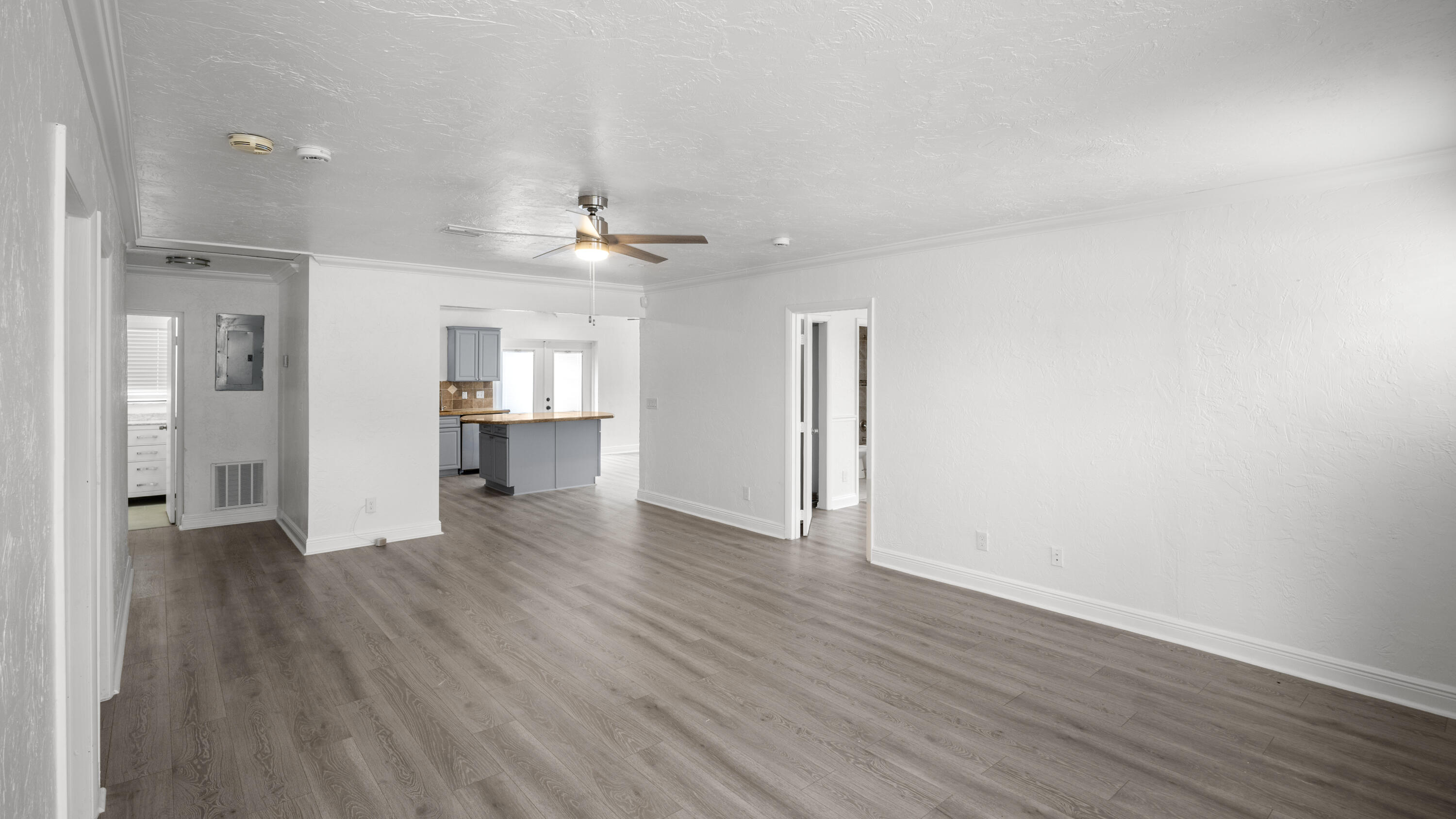 1233 West 32nd Street Riviera Beach, FL 33404 - Photo 9 of 25 wooden floor in an empty room with a window