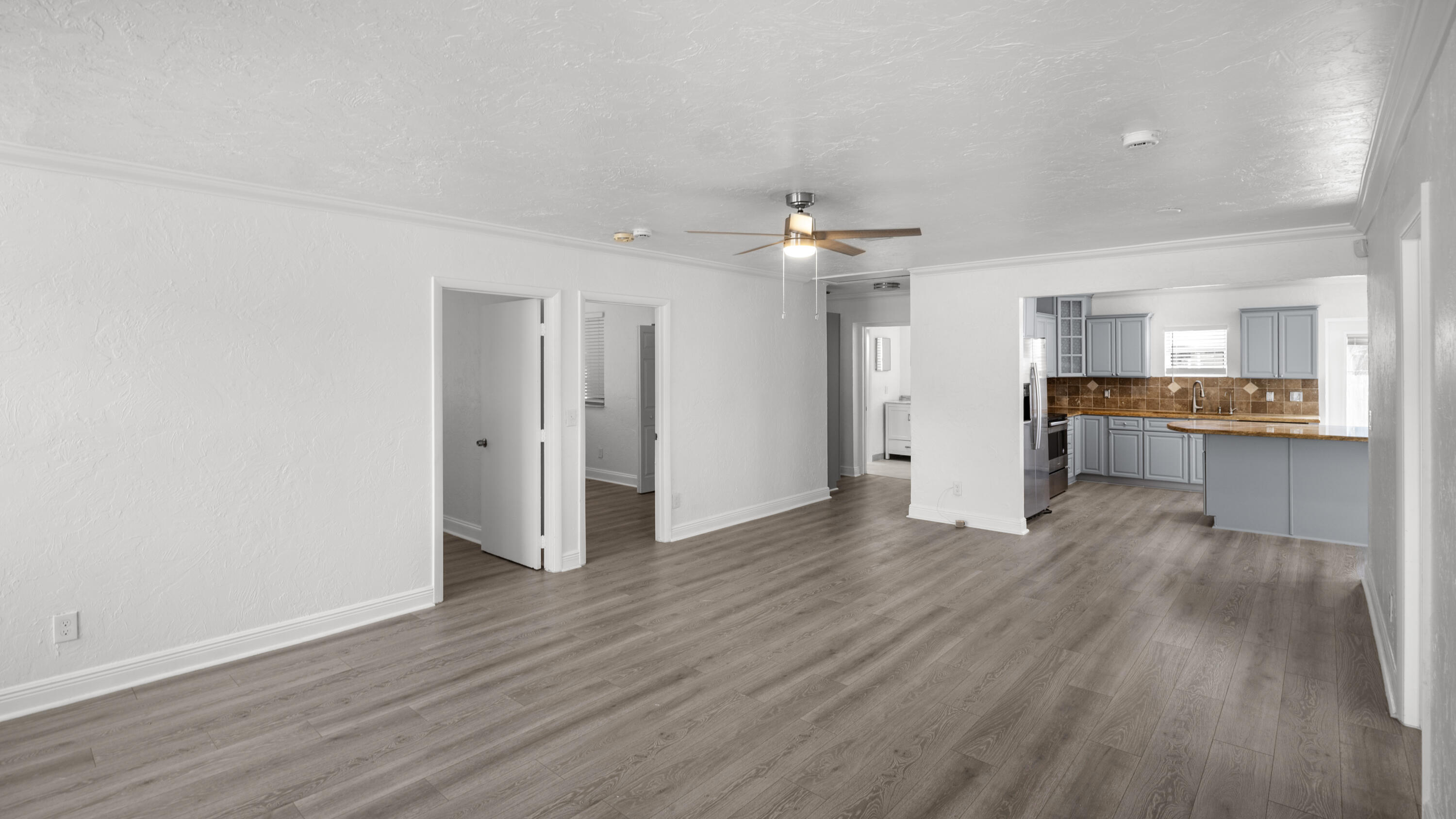 1233 West 32nd Street Riviera Beach, FL 33404 - Photo 10 of 25 a view of a kitchen with wooden floor and a kitchen